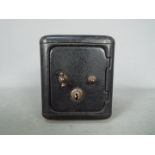 A vintage, novelty money bank in the form of a bank safe, approximately 11 cm (h).