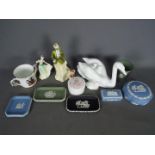 A mixed lot of ceramics to inlculde Wedgwood Jasperware, Royal Doulton figurines and similar.