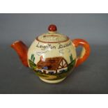 A vintage Manor Ware, novelty money bank in the form of a teapot,