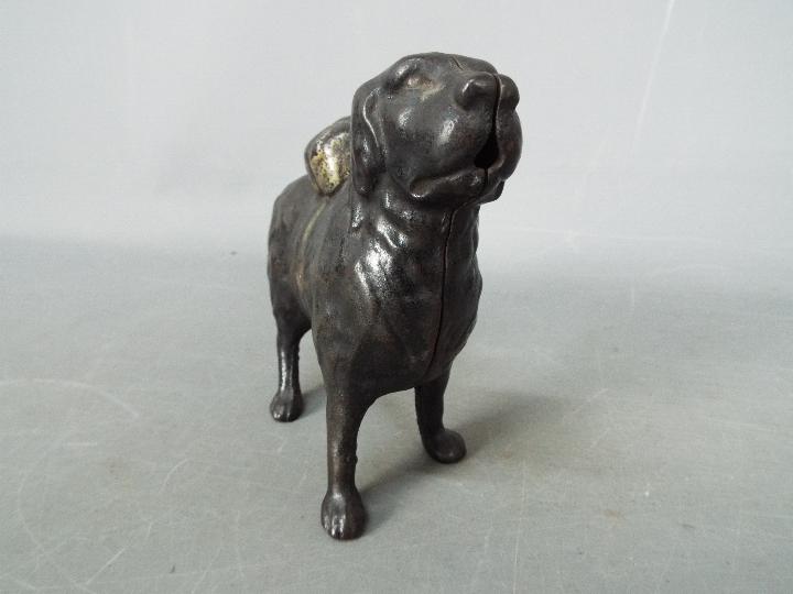 A cast iron money bank in the form of a St Bernard dog, - Image 3 of 8