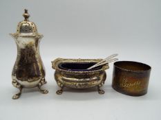 A collection of hallmarked silver items to include open salt with blue glass liner and pepperette,
