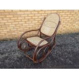 Large bentwood rocking chair with cane seat and back.