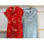 Two Chinese cheongsam type dresses, one in light blue with silver coloured thread,