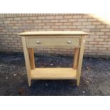 A modern, light oak console table, approximately 75 cm x 79 cm x 30 cm.