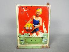 A vintage German, tinplate novelty money bank,