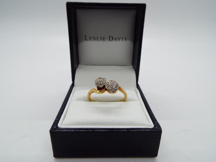 18 ct gold - a 18 ct gold diamond cluster ring set with fourteen 0.2/0.3 points, stamped W.