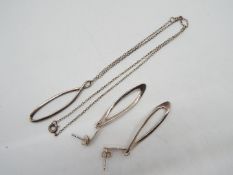 A silver necklace set,