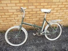A vintage Raleigh Stowaway bicycle.