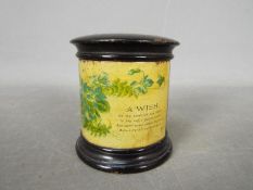 A vintage, black lacquer, Mauchline Ware money bank, applied label reading 'A Wish.