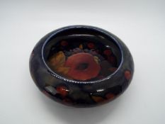 Moorcroft - a Moorcroft dish in the Pomegranate design with some restoration