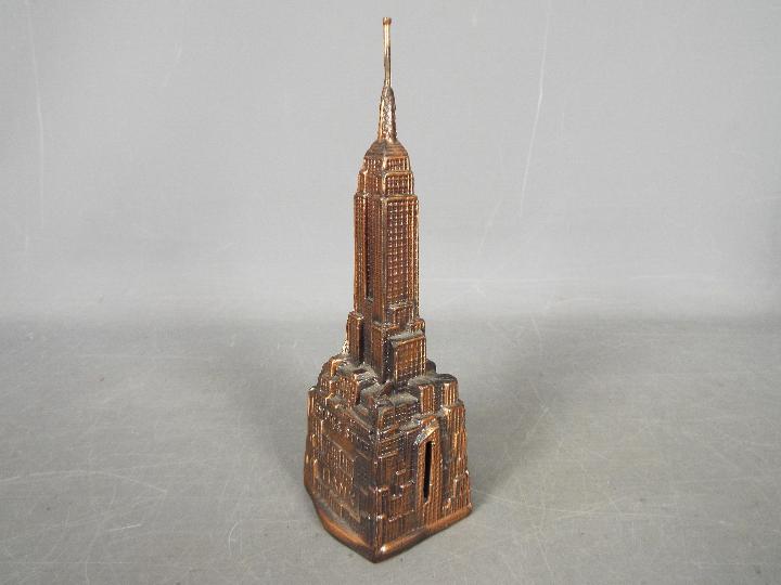A vintage cast metal money bank of architectural form depicting the Empire State Building, - Image 3 of 5