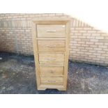 A modern, light oak, tall boy chest of five drawers by J. B.