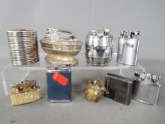 A collection of vintage cigarette lighters to include Ronson, MTC, Tiki and similar.