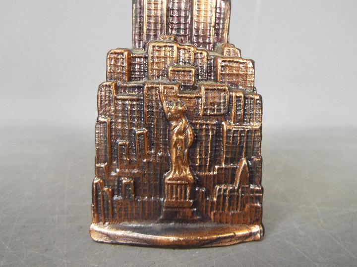 A vintage cast metal money bank of architectural form depicting the Empire State Building, - Image 4 of 5