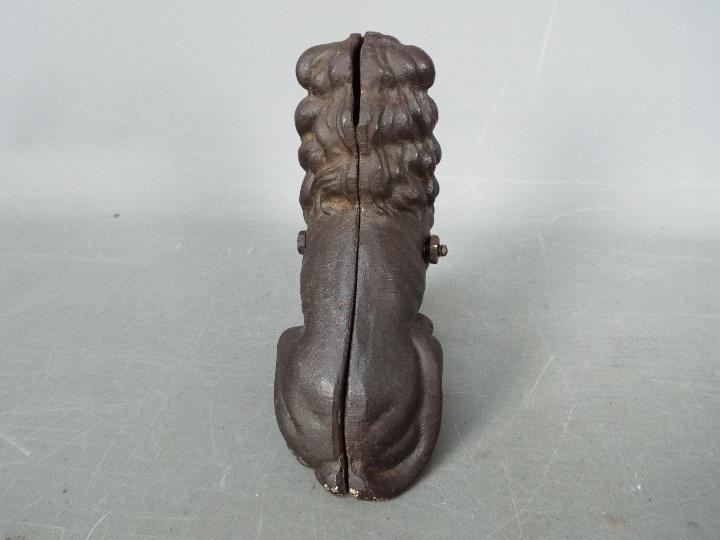 A cast iron money bank in the form of a seated male lion, - Image 4 of 5