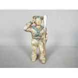A cold painted, cast iron, novelty money bank in the form of a saluting sailor,