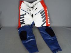 A pair of Repsol Honda motorcycle leather trousers,