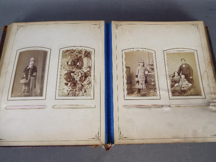 A Victorian, leather bound photograph album with metal clasp, containing photographs. - Image 6 of 10