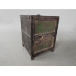 A late 19th century novelty money bank in the form of a bank safe, approximately 9 cm (h).