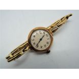 A lady's 9ct gold cased wristwatch on 9ct expanding bracelet, approximately 18 grams all in.