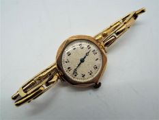 A lady's 9ct gold cased wristwatch on 9ct expanding bracelet, approximately 18 grams all in.