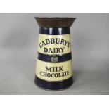 A Cadbury's Dairy Milk Chocolate tinplate, advertising money bank in the form of a milk churn,