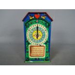 A vintage, German, tinplate chocolate dispenser type money bank,