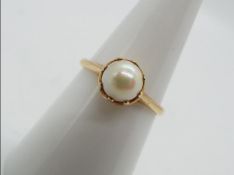 9 ct gold - a 9ct gold ring set with pearl, markings unclear, size N, approximate weight 2.