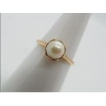 9 ct gold - a 9ct gold ring set with pearl, markings unclear, size N, approximate weight 2.