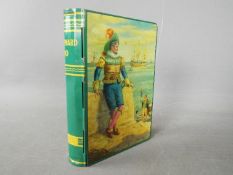 A Chad Valley novelty tinplate money box in the form of a book,