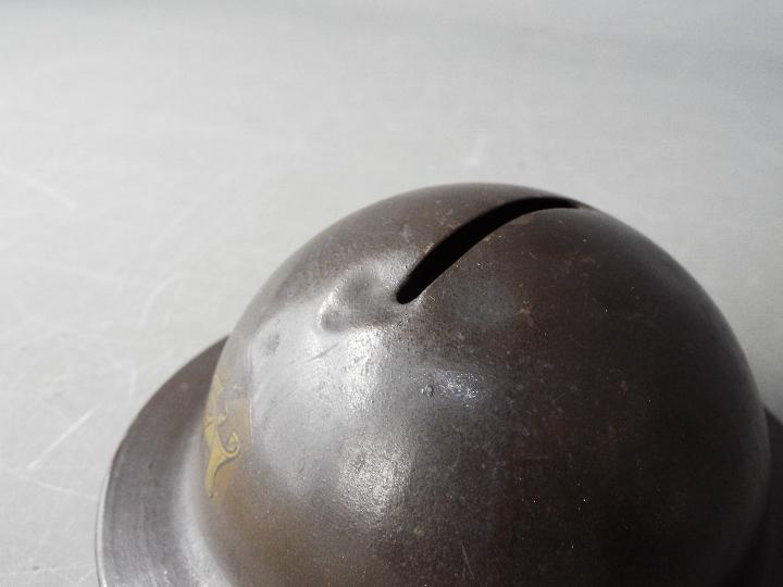 A World War One period novelty, tin money bank in the form of a helmet, titled 'Tommy's Tin Hat' 4. - Image 6 of 6