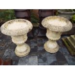A matched pair of weathered stoneware planters,