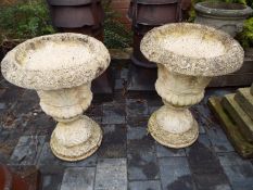 A matched pair of weathered stoneware planters,