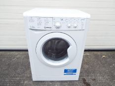 An Indesit freestanding washer dryer,