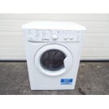 An Indesit freestanding washer dryer,