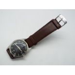 An HMT Jawan military style wristwatch, 35 mm diameter case on leather strap.
