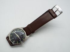 An HMT Jawan military style wristwatch, 35 mm diameter case on leather strap.