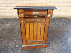A good quality side cupboard with upper frieze drawer having carved decoration,