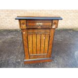 A good quality side cupboard with upper frieze drawer having carved decoration,