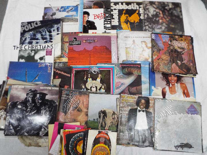 A collection of vinyl records, 12" and 7" to include Black Sabbath, Michael Jackson, Blondie,