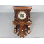 A decorative German ‘wag on the wall’ Freischwinger clock,