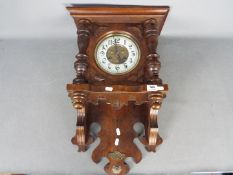 A decorative German ‘wag on the wall’ Freischwinger clock,