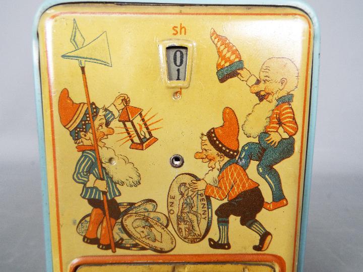 A vintage German, tinplate novelty money bank, one side printed with two children and their mother, - Image 6 of 6