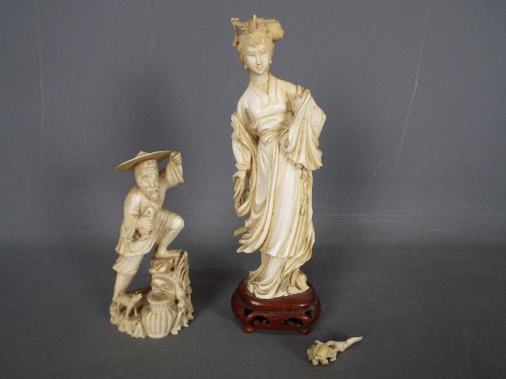 Two early 20th century ivory figurines comprising a fisherman and a courtesan (hand broken but