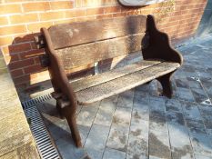 Garden Furniture - a wooden bench seat,
