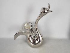 Unused Retail Stock - A boxed ceramic swan with metallic, silver coloured finish,