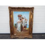 A large, ornately framed oil on canvas depicting a man, woman and child,