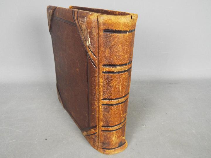 A Victorian, leather bound photograph album with metal clasp, containing photographs. - Image 10 of 10