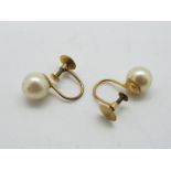 9ct - a pair of 9ct gold earrings with pearl design stamped 9ct