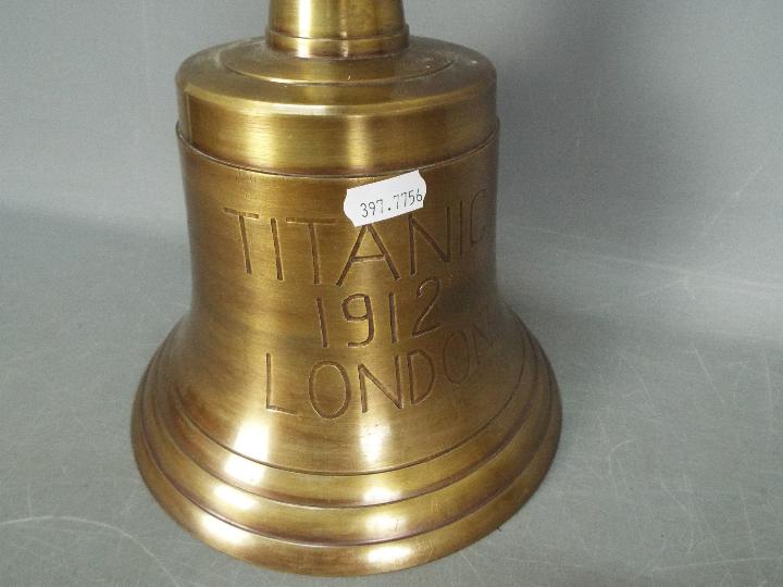 A large brass bell marked 'Titanic 1912', walking stick and similar. - Image 3 of 5